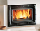 Jotul F 100 wood burning stove in fireplace thumbnail