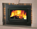 Jotul F 100 wood burning stove in fireplace thumbnail